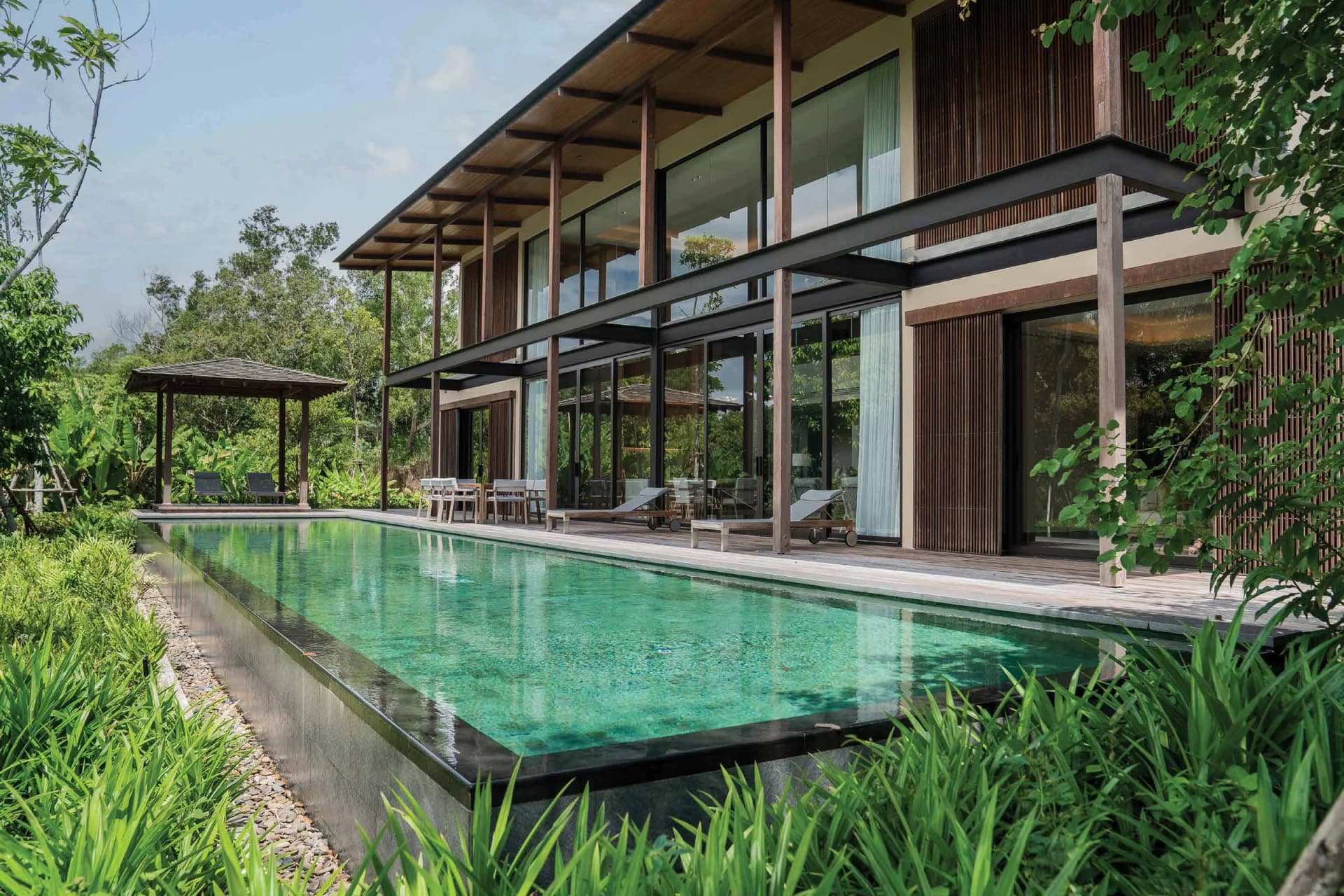 The 20 m pool of a built VANA 4 villa, with a sala at its end